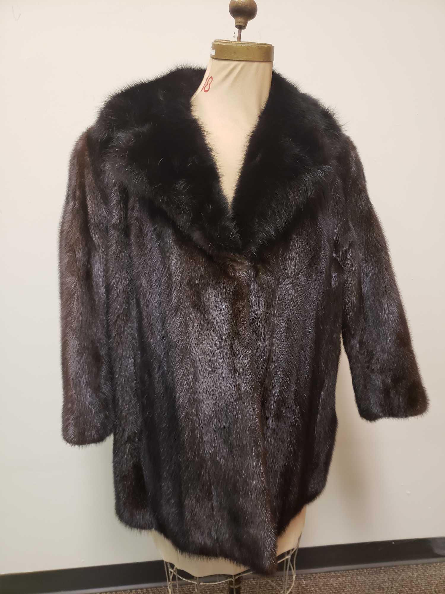 Mink Fur Coat with Fox Fur Collar: Mink Fur Coat with Fox Fur Collar. This fur coat is in great used condition. There are no known damages to the interior or exterior of the coat. The interior lining of the coat is black fabric. There