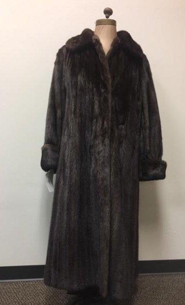Mink Fur Full Length Coat by Givenchy: Mink Fur Full Length Coat by Givenchy; this long mahogany brown coat shows a lovely sheen. The coat appears to be new, never worn. The label shows "Givenchy". The coat shows a traditional style with t