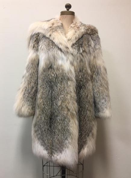 Silver Fox Fur Wrap Style Jacket w/ Hood: Silver Fox Fur Wrap Style Jacket w/ Hood;Â Â a very stylish coat that shows a silver dapple pelt. The back of the coat shows very layout work of the pelts. The large collar will cover the wearer's