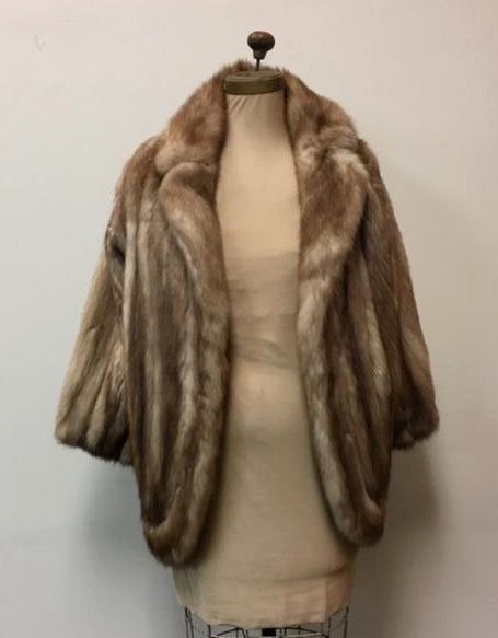 Stone Martin Fur Jacket: Stone Martin Fur Jacket; a soft beautiful coat. The jacket showsÂ two (2) clasps and a handkerchief pocket on the right interior flap. The coat is not marked. The condition is excellent, there are 