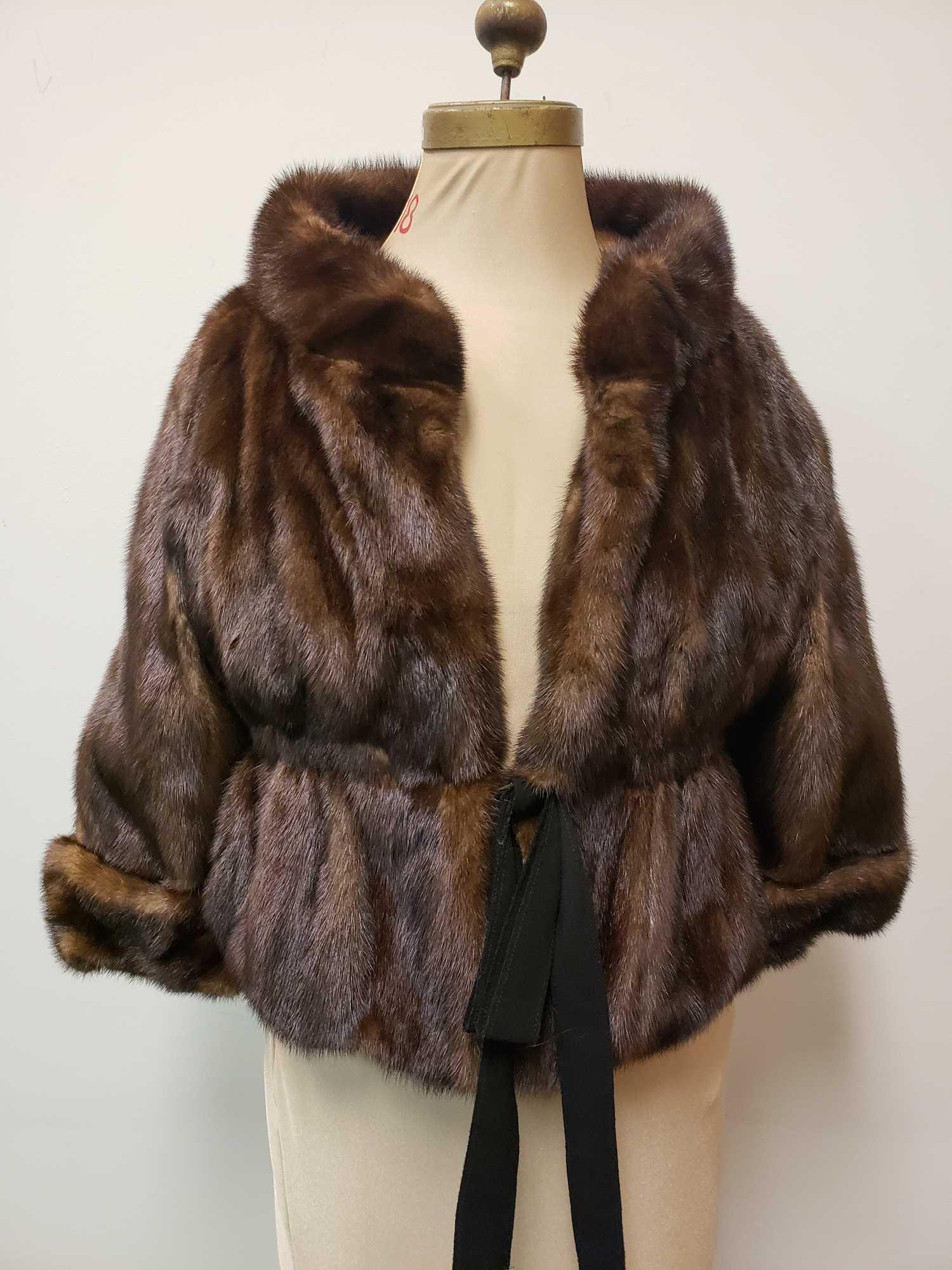 Mink Waist Jacket: Mink Waist Jacket. This jacket is in good used condition. There is a rip at the top right shoulder (see images) which is about a half inch long. The jacket has a hook and loop closure which is covered