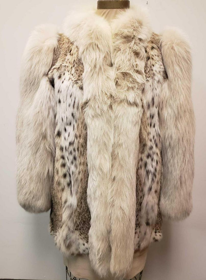 Galliano Fourrures Bobcat and Fox Fur Coat: Galliano Fourrures Bobcat and Fox Fur Coat. This bobcat and fox fur coat is in great used condition. There is no known damage to the interior or exterior of the coat. The coat has a tan interior fabri