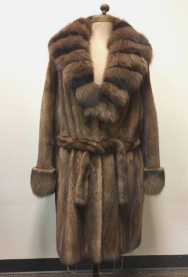 Full Length Mink Fur Coat with Fox Fur Trim: Full Length Mink Fur Coat with Fox Fur Trim; a striking coat blending these two furs into a very rich and warm look. The coat shows a belt (exterior), two (2) clasps and two (2) concealed pockets on t