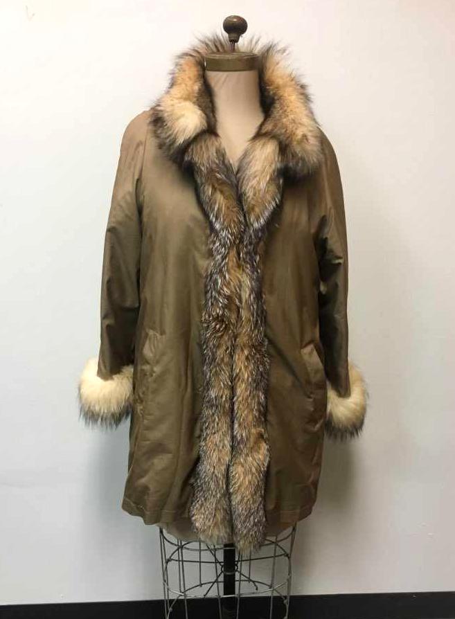 Retro Nylon Jacket with Fox Fur Trim and Shearling: Nylon Jacket with Fox Fur Trim and Shearling Lining; a nice dark tan coat that shows fox fur collar and cuffs.Â The coat shows three (3) clasps and two (2) front pockets. The lining is shearling fur