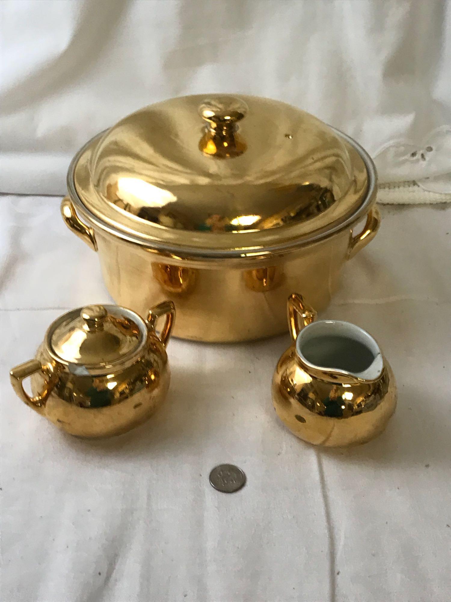 Vintage Golden Glo Hall 22 K Gold China: Vintage Golden Glo Hall 22 K Gold China; Glamorous Mid Century Modern serving setÂ with real 22K gold comes complete with a soup tureen,Â and a cream and sugar set. There is one visible chip on 