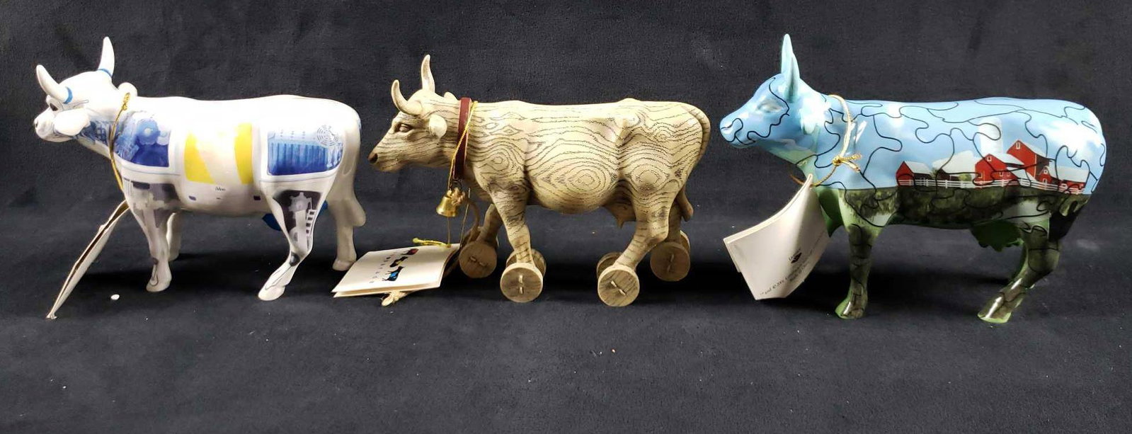 Lot of 3 Toy and Computer Cow Figurines: Lot of 3 Toy and Computer Cow Figurines.Â This lot of cow figurines is in great condition. All cows come in original boxes and packaging. The cows have no chips, cracks or other imperfections. The c