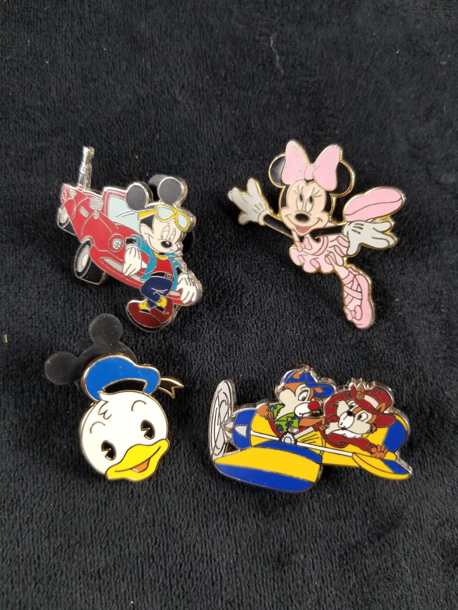 Mickey Mouse And Friends Pin Lot Of Five: This lot includes:Â 2004 "Mickey Mouse leaning on a red car.",Â 2001: "Minnie Mouse Ballerina"., "2004 Chip & Dale Rescue Rangers In Plane" and "Happy Baby Donald Duck". Pins are all in good, con