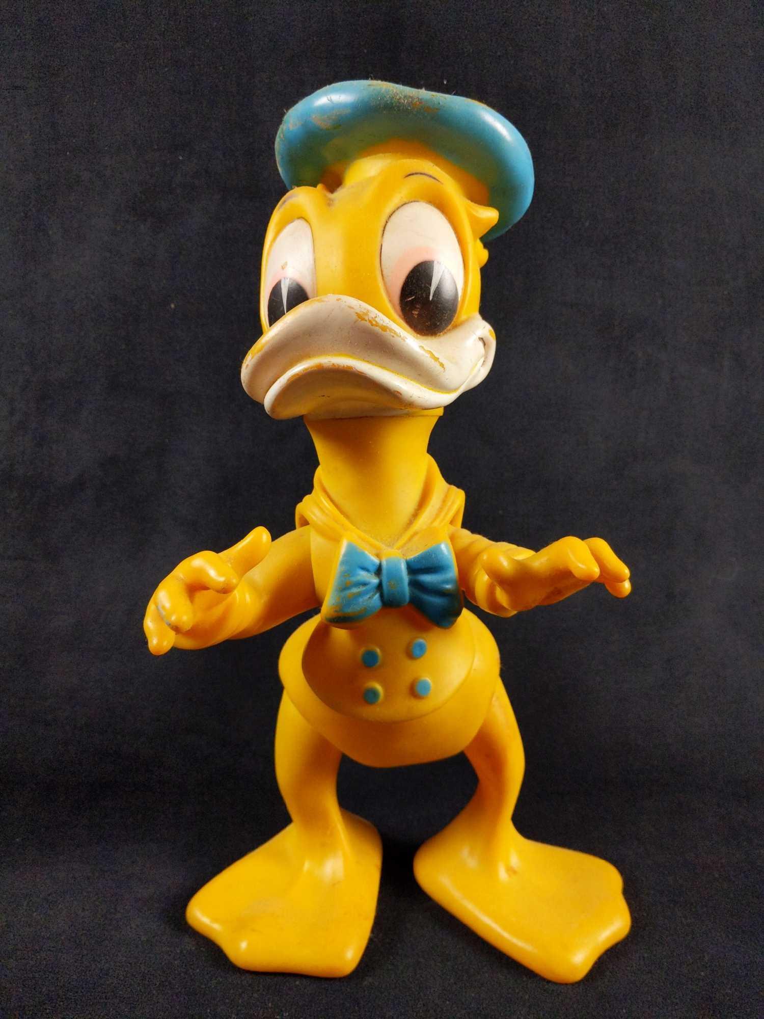 1960s Antique 12 inch Donald Duck Vinyl Rubber Toy: This is a very rare and hard to find toy from the 1960's. This Disney toy was produced by a Brazilian company named Estrella. He is made out of vinyl rubber and is posable. The arms,legs and head move