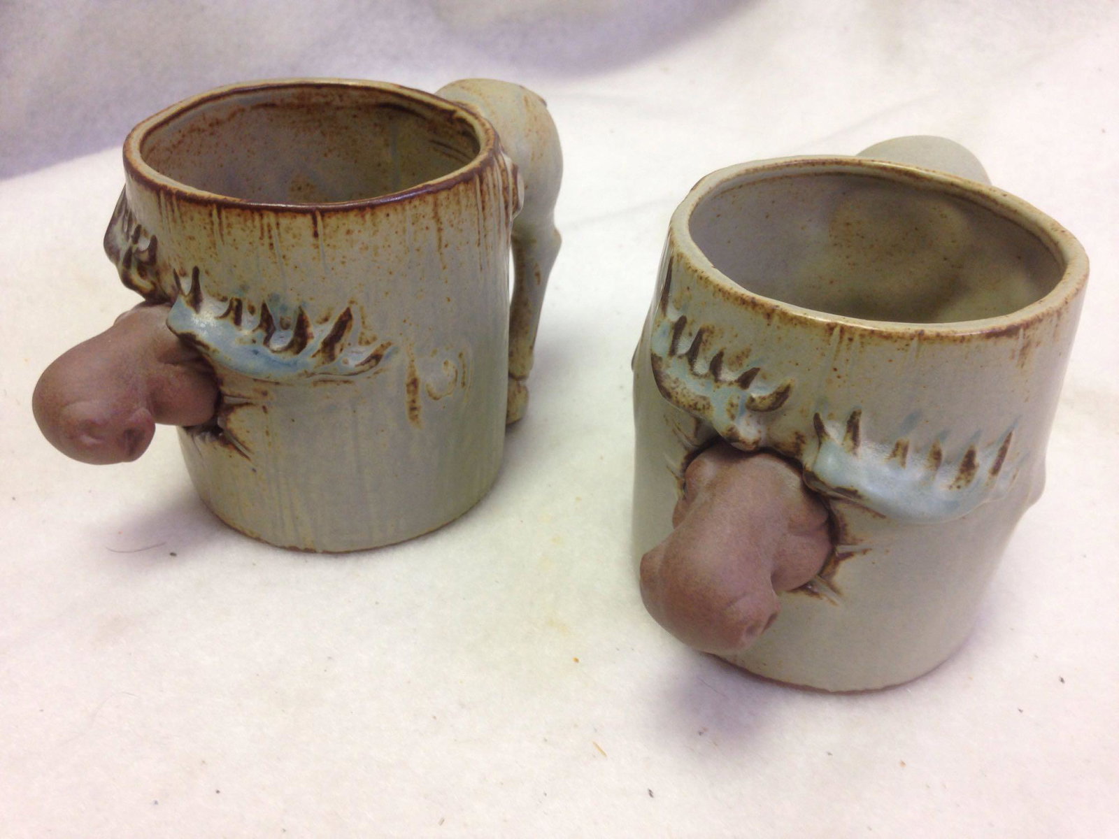 2 handmade Stoneware Ceramic Coffee Cup With a MOOSE: Like a Canadian Moose? If so this is for you.Â 2 handmade ceramic Moose cups.Â These were made by a true craftsperson and a super fun!Â Â