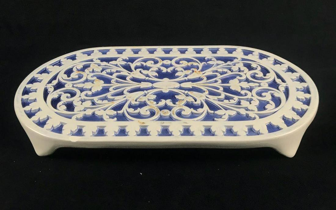 Hand Painted Italian Trivet: Hand Painted Italian Trivet. This trivet is in good condition. It hasone small chip out of the top surface and will need to be cleaned because it has a residue stuck to the surface. On the back "Hand