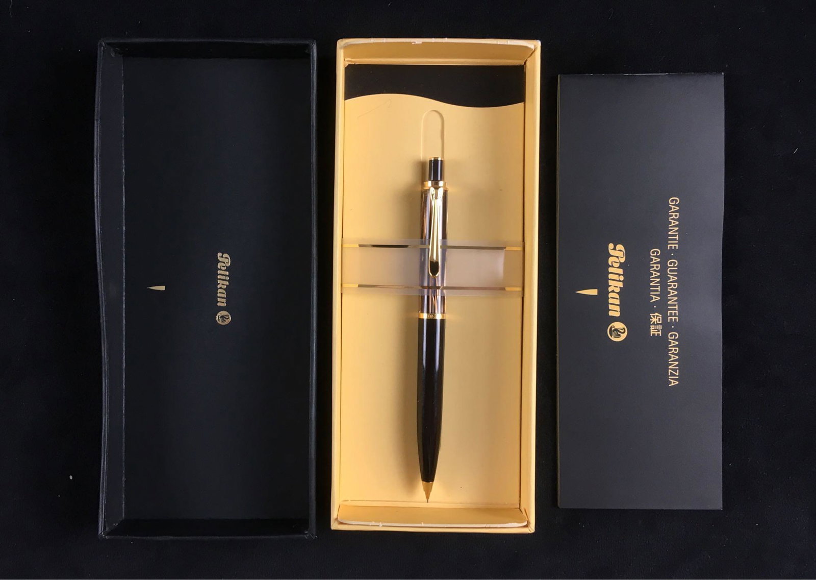 PelikanÂ Mechanical Pencil, New Old Stock: PelikanÂ Mechanical Pencil, New Old Stock; a very fine mechanical writing tool showing deep brown barrel with mother of pearl and gold accent. This pencil is in new condition in the original packagi