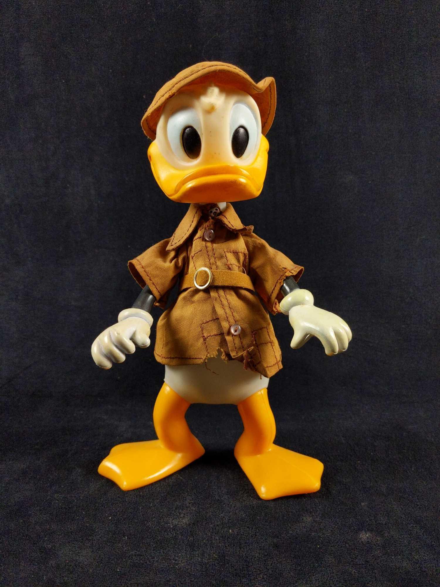 1960s Vintage Durham Disney Safari Donald Duck Toy: Vintage 1960's Disney Safari Donald Duck made by Durham. This toy is in good used condition with expected signs of aging like discoloration in the white plastic and some small rips on Donald's outfit 