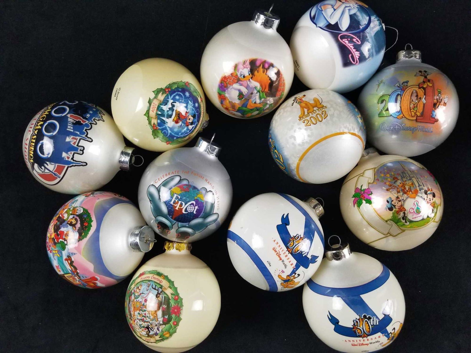 Lot of 12 Walt Disney Glass Ball Christmas Ornaments: This lot if for 12 glass ball Christmas ornaments that measure 3 inches tall. They are all in good used condition with no known damages besides normal wear scuffing.Â 1) 1998 Happy Holidays Mickey 