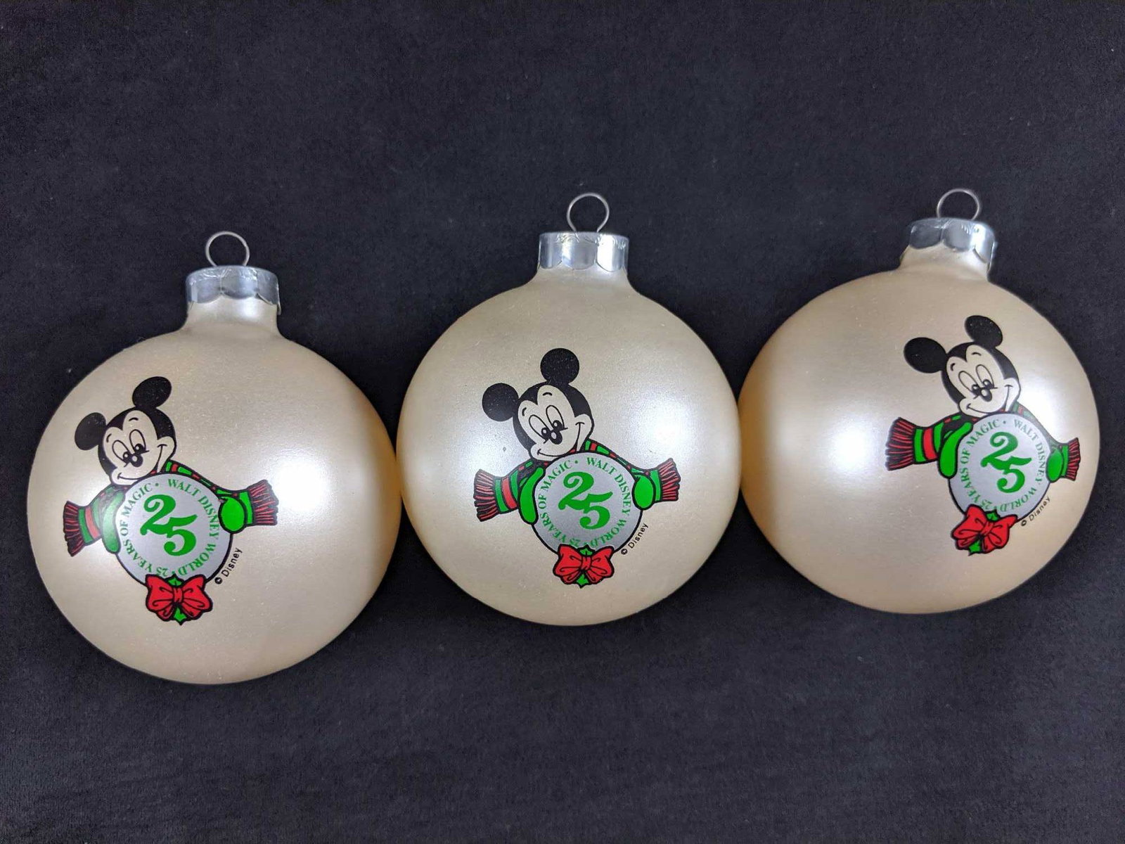 Disney Cast Member Exclusive Christmas 1996 Glass: Glass round ornaments that were given out to Disney cast members for the 25th anniversary of the Walt Disney Resort. Ornaments are approx 3" across and feature Mickey Mouse and the 25th anniversary lo