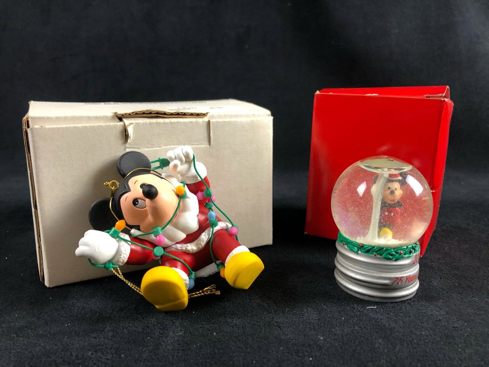Lot Of 2 Mickey Mouse Ornament Tangled in Lights: Lot Of 2 Mickey Mouse Ornament Tangled in Lights Christmas Mini Water Snow Globe This lot features 2 Mickey Mouse Christmas items. In great condition with no known scuffs or marks (1) Mickey Mouse Chr