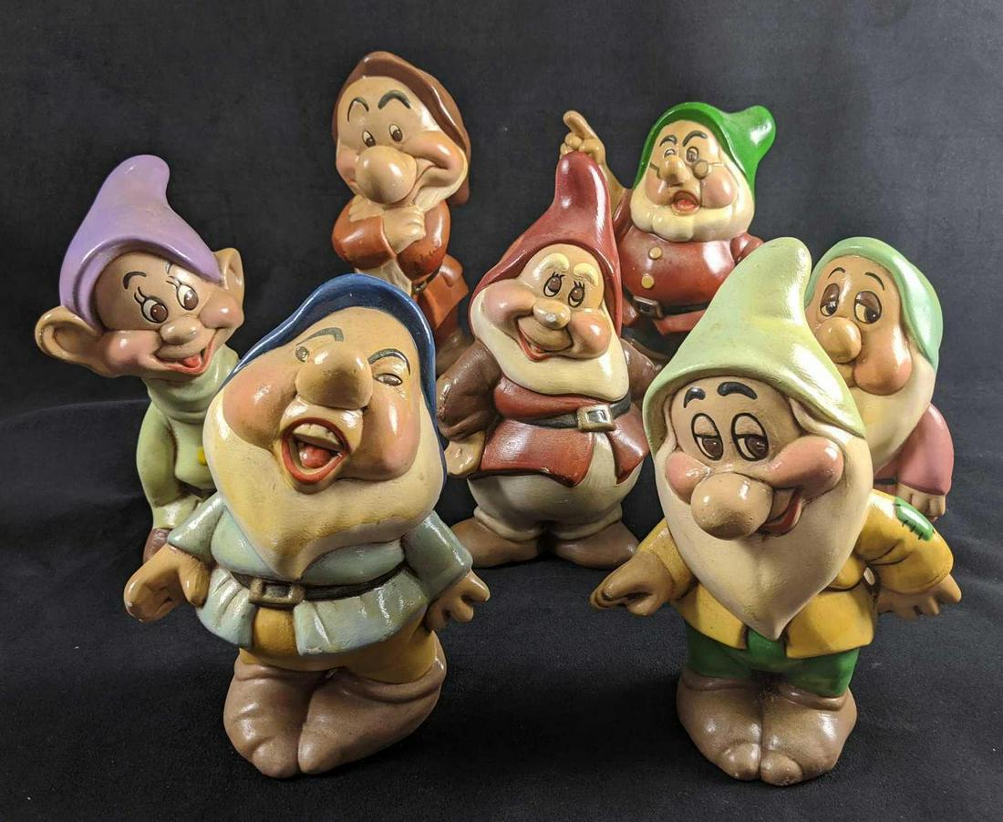 Vintage Ceramic Disney Seven Dwarfs: This is a set of all seven dwarves. Hand painted. Appeared to have been used as garden gnomes by previous owner. Figures' paint is colorful, but there are signs of being outside, like water stains and
