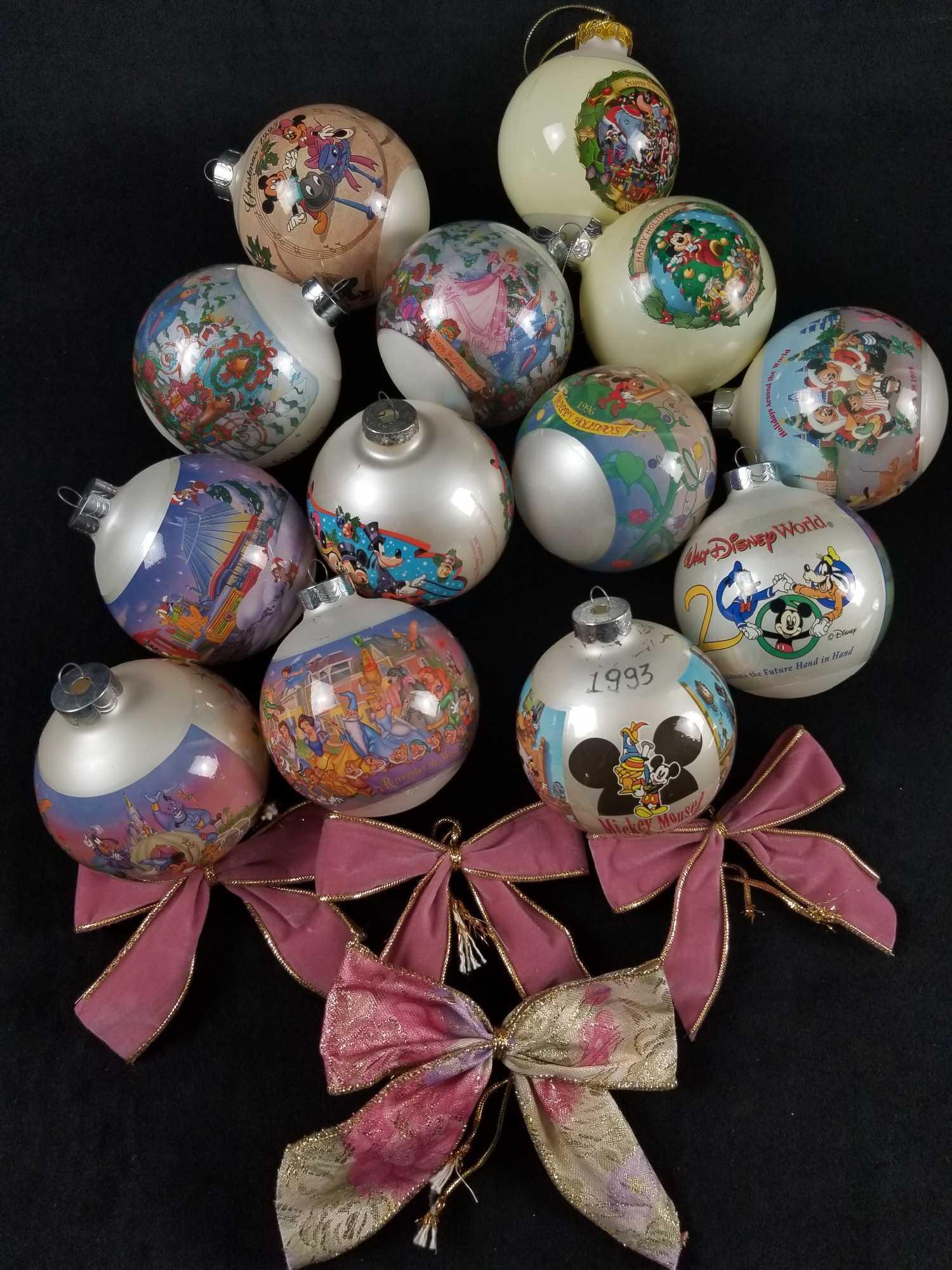 Vintage Disney Glass Round Ornaments and Bows Lot of 17: This lot is for 17 Christmas ornament that are in used condition. Please see pictures. Lot includes: 1) 2000 Walt Disney World Christmas glass round ornament. It is in good used condition with no know