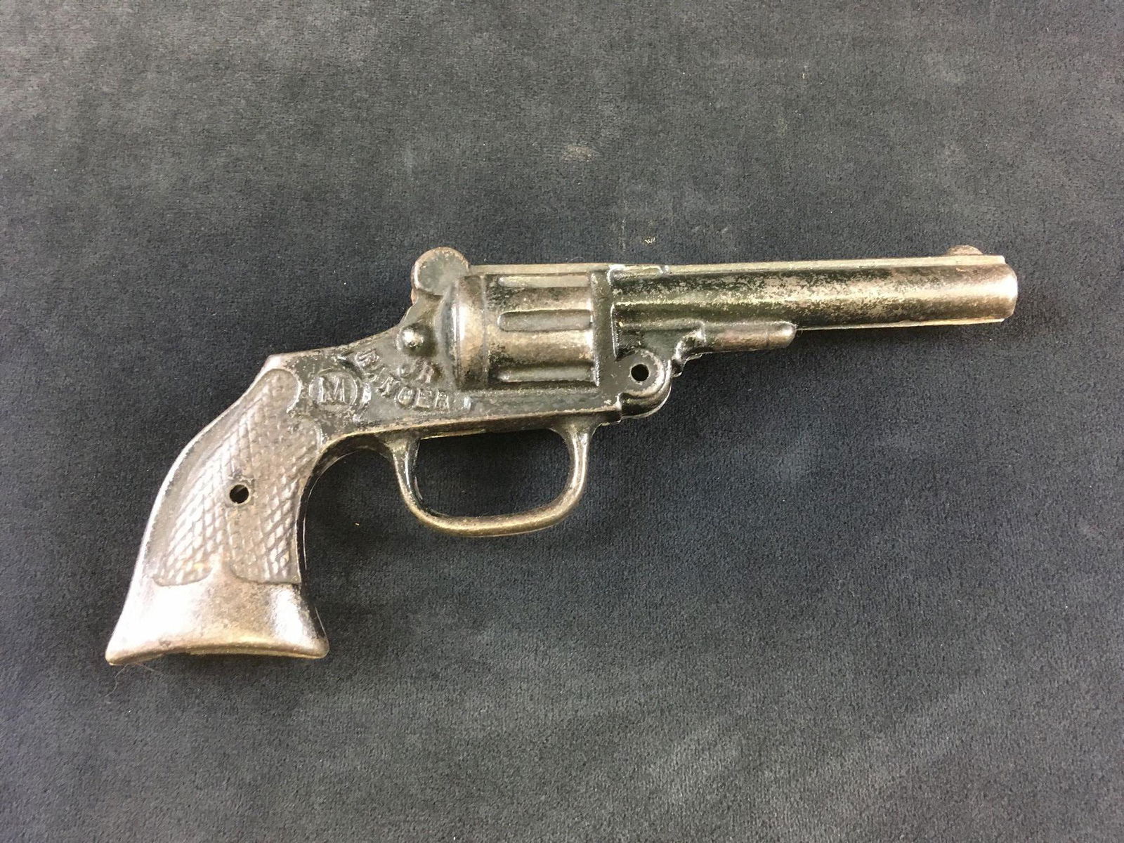 Vintage Jr Ranger Toy Cast Iron Cap Pistol by Mordt: Vintage Jr Ranger Toy Cast Iron Cap Pistol, by Mordt; this pistol shows the "M" logo. It is in fair condition as it is missing trigger, hammer, and the fastenings that hold the two cast pieces togethe