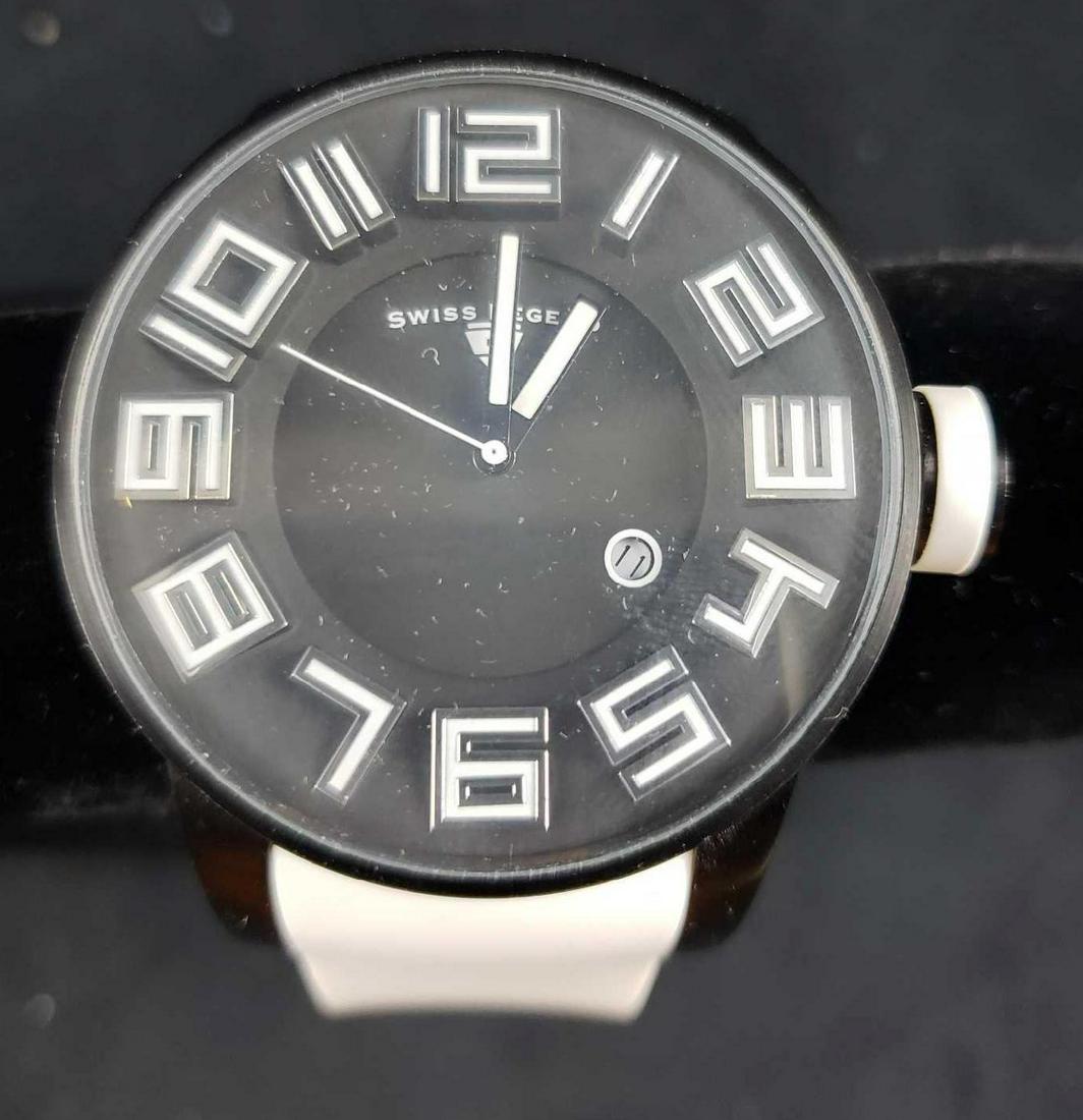 Swiss Legend Men's Airbourne Watch: White band with black face and bezel. Very good used condition with no known damages. Sterling silver backing. This watch is untested and may need a new battery.Â Â