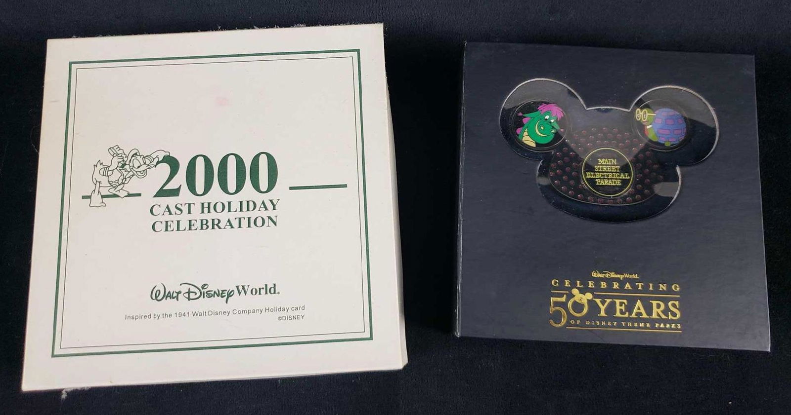 Set of 2 Walt Disney World Collectible Anniversary Pins: Set of 2 Walt Disney World Collectible Anniversary Pins. This lot of collectible pins is in great used condition. The pin sets are in the original packaging and look to have never/if ever been worn. P