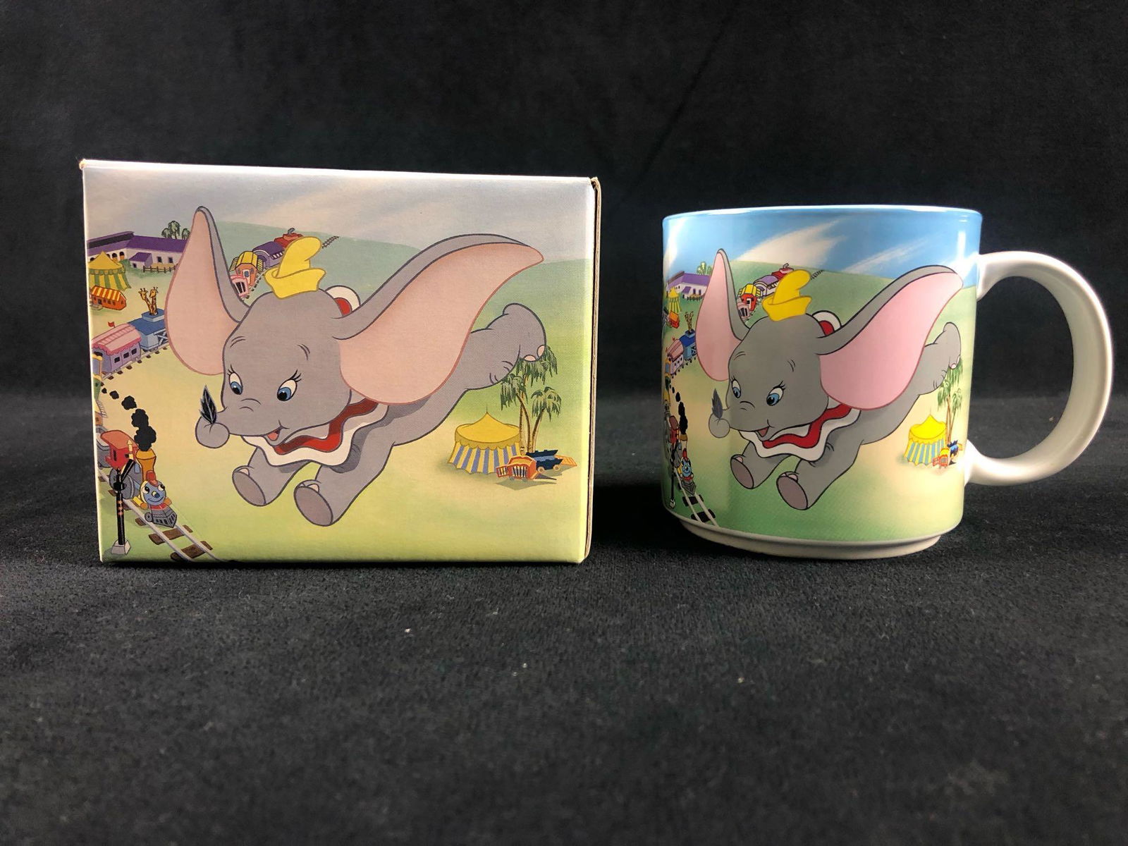 Vintage Walt Disney Classic Flying Dumbo Timothy Q: Vintage Walt Disney Classic Flying Dumbo Circus Coffee Mug Cup The souvenir mug is made from ceramic and features a colorful movie scene from Dumbo. The mug is in great condition with no known damages