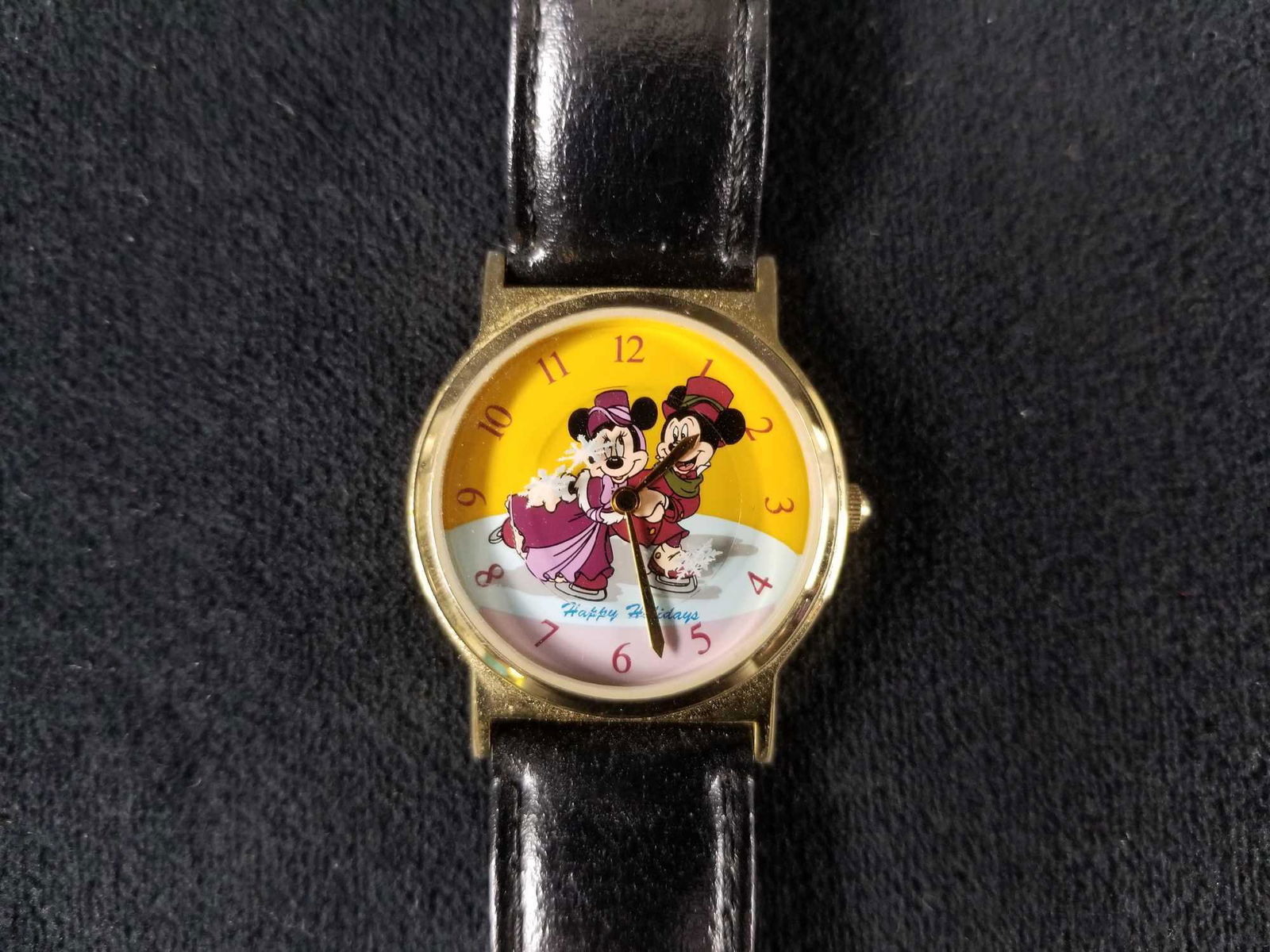 Vintage 1998 Disney Cast Holiday Watch Mickey Minnie: Vintage 1998 Disney Cast Holiday Watch Mickey Minnie Ice Skating. This watch features rotating snowflakes for the second hand. This watch is a Disney cast member exclusive item that was given to cast