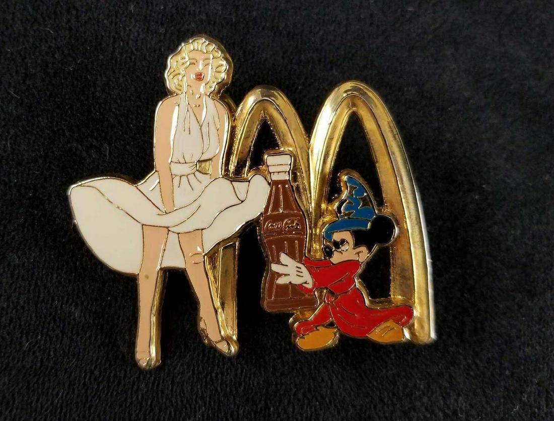 Rare Marilyn Monroe Disney Coca Cola McDonalds Sorcerer: Interesting little pin that has it all.Â Sorcerer Mickey,Â Marilyn Monroe, McDonalds And Coca Cola. This pin is approx 2" x 2" and is in good used condition with no known damages or markings. For 