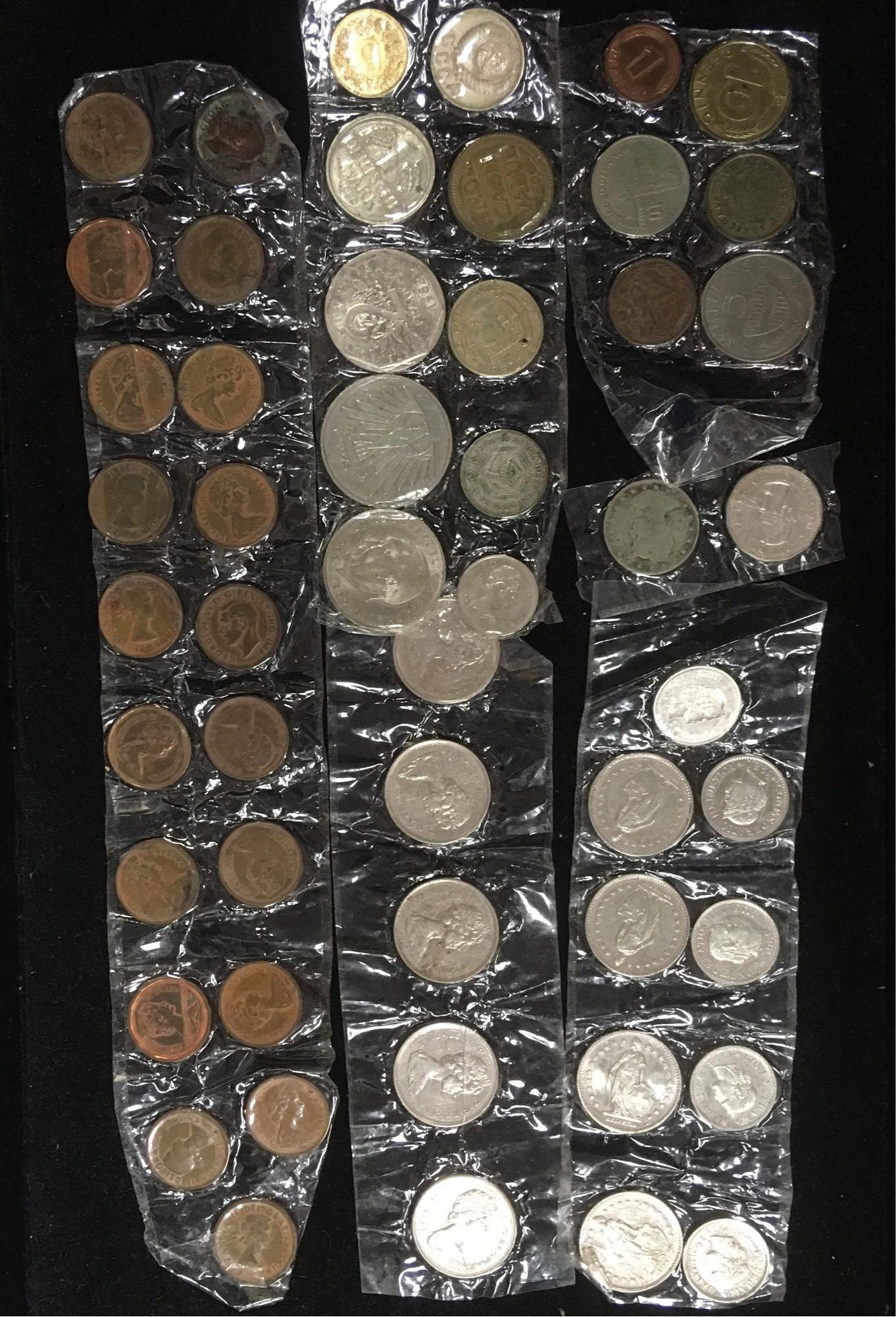 Mixed Lot of World Coins: Coins from all over, countries like Jamaica, Austria, Soviet Union, Canada, Netherlands, MoroccoÂ and many more. 107 coins in all.