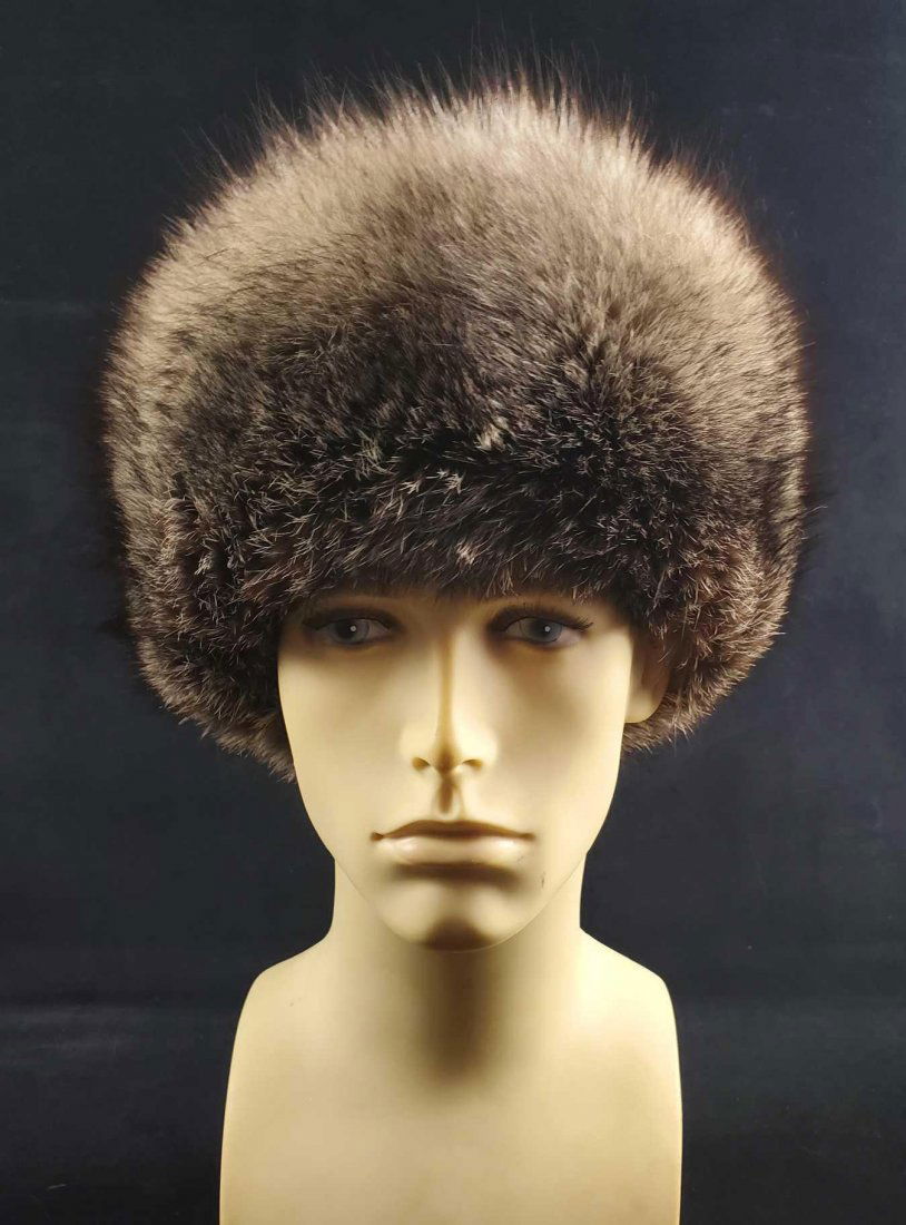 Silver Fox Fur Cap Hat: This stylish yet elegant silver fox fur cap is made by an unknown manufacturer. The top of the hat is made by a leather like material and has a python look with gray and black hues. The inside materia
