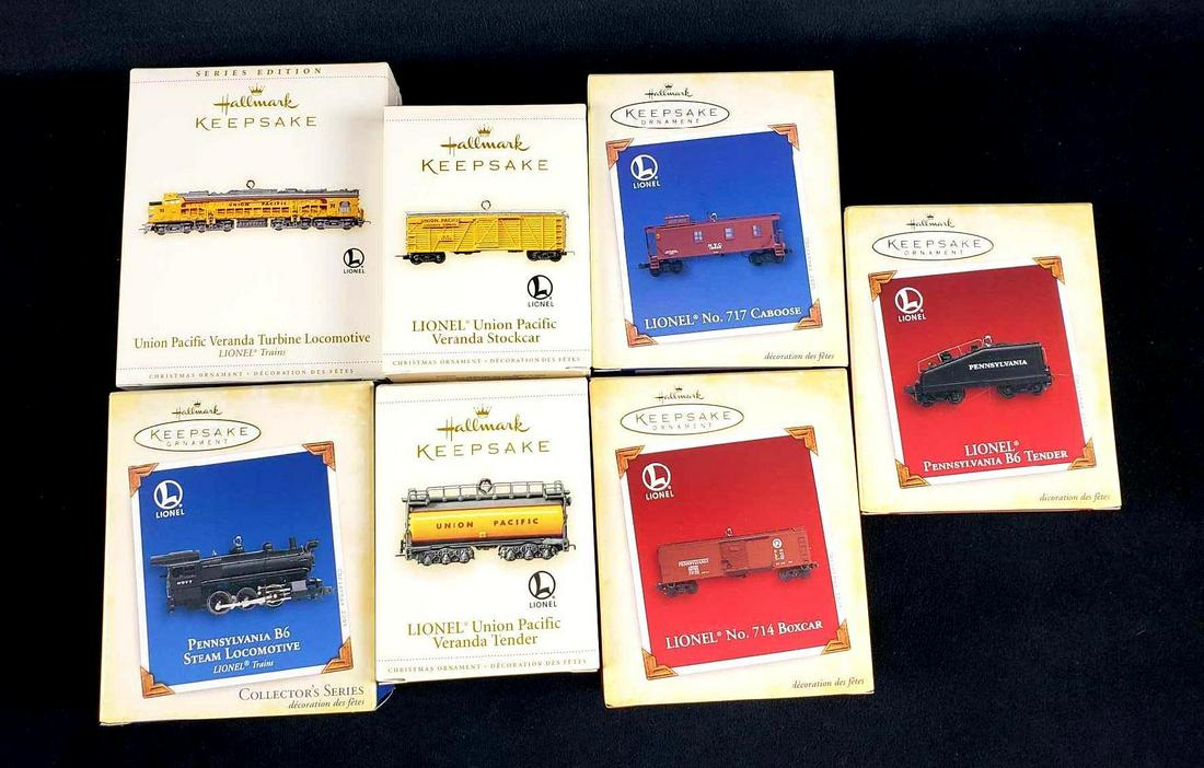 Lot of 7 Hallmark Keepsake Lionel Train Ornaments: Lot of 7 Hallmark Keepsake Lionel Train Ornaments. This lot of ornaments is new old stock. The items are in the original boxes with packaging. Items are die cast metal and handcrafted from 2006. The i