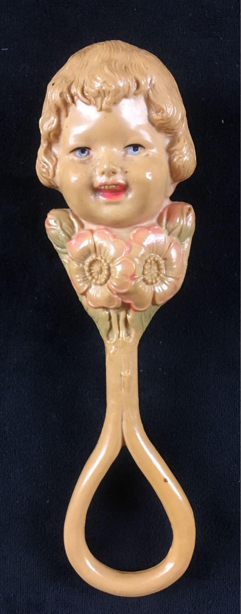 Antique Celluloid Baby Rattle: Antique Celluloid Baby Rattle; It does have some wear due to age, but overall an amazing antique piece. It measures at approximately .
