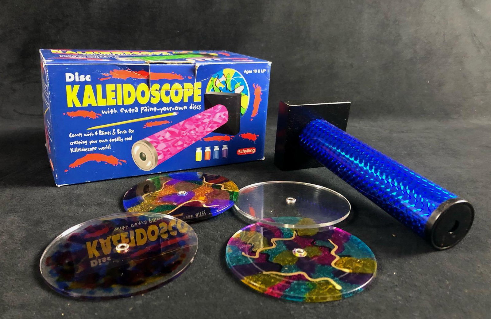 Vintage Childrens Kaleidoscopes Toy Schylling Disc: Vintage Childrens Kaleidoscopes Toy SchyllingÂ Disc The lot of a vintage children's Kaleidoscope consist of the original box from Schylling. The items in the box consist of 4 Disc. Three of the disc
