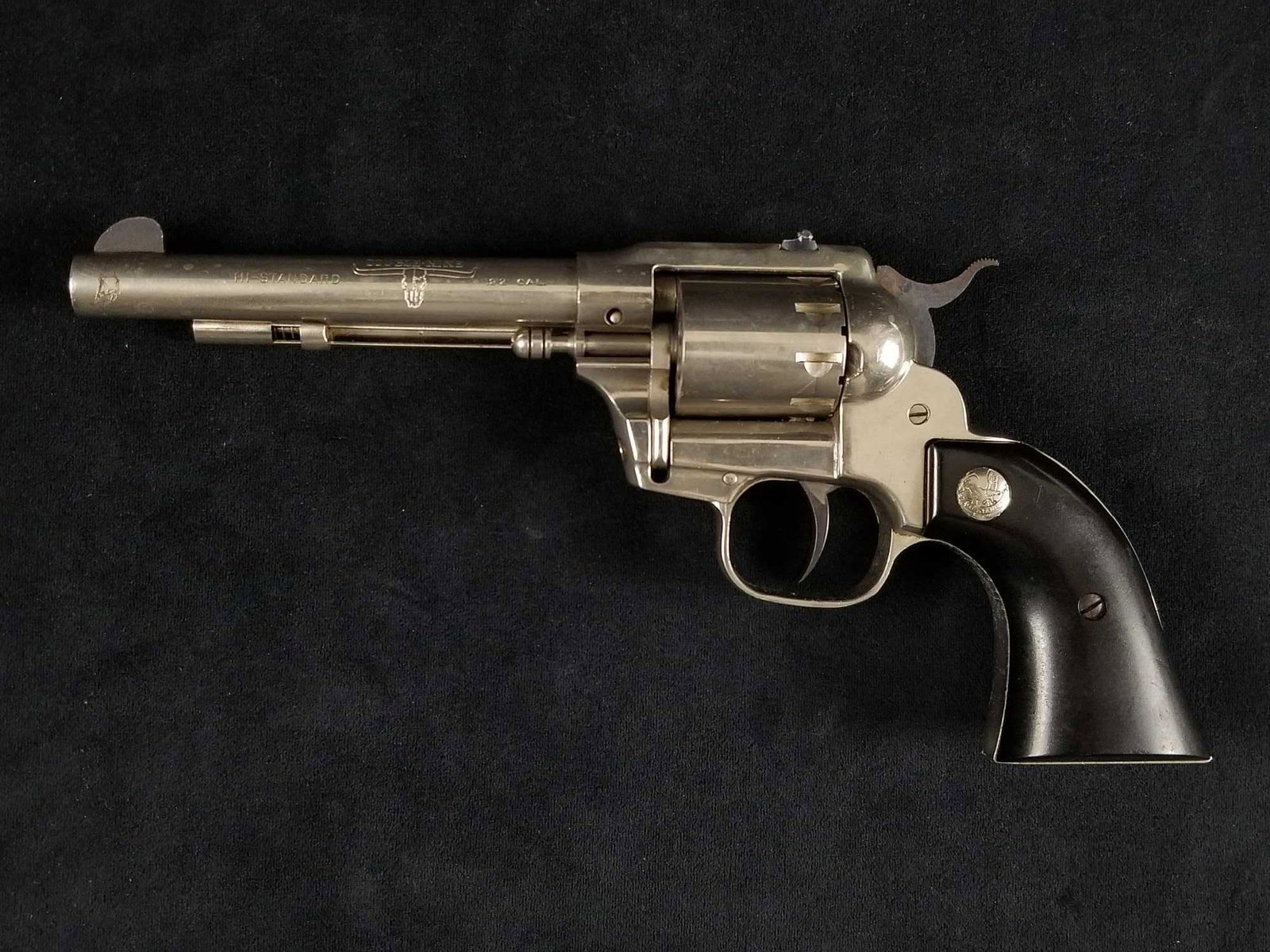Hi Standard Double Nine .22 Caliber: This is a High Standard MFG. Corp. Manufatered in Hamden, Conn. USA model W-100 Double Nine .22 Caliber double action nine shot revolver. Circa 1950's. This revolver features a nickel finish with blac