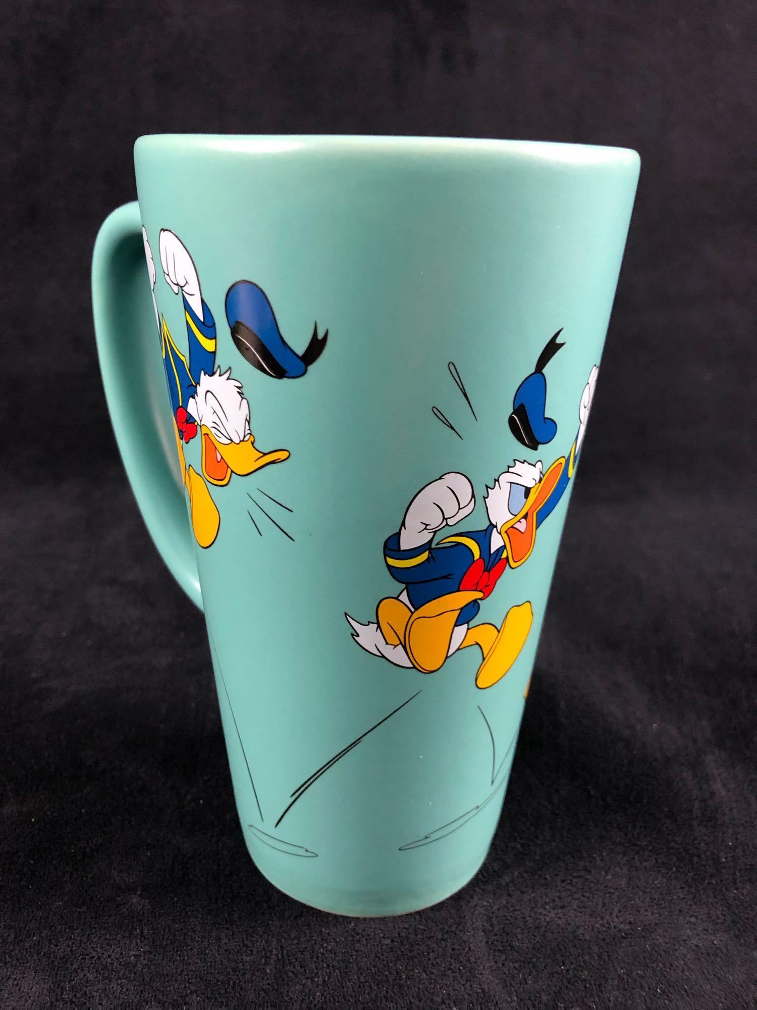 Vintage Donald Duck Jumping Mad Ceramic Matte Coffee: Vintage Donald Duck Jumping Mad Ceramic Matte Coffee Tea Mug Donald Duck is jumping mad in 4 different poses. His animated self is feeling the hot or cold of your beverage filling up the mug. Enjoy yo
