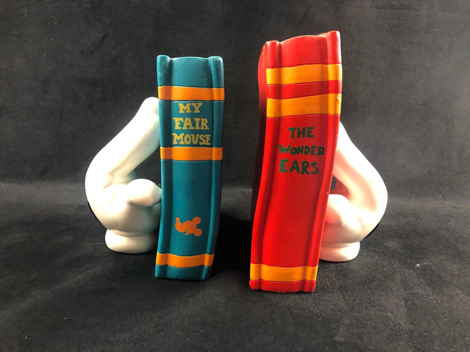 Walt Disney Mickey Mouse Bookends The Wonder Ears My: A pair of Toon-CityÂ style Mickey Mouse white gloves on books. The bookends are cartoon-style and are reminiscent of the Mickey Mouse House at Disneyland and formerly at Walt Disney World The left b
