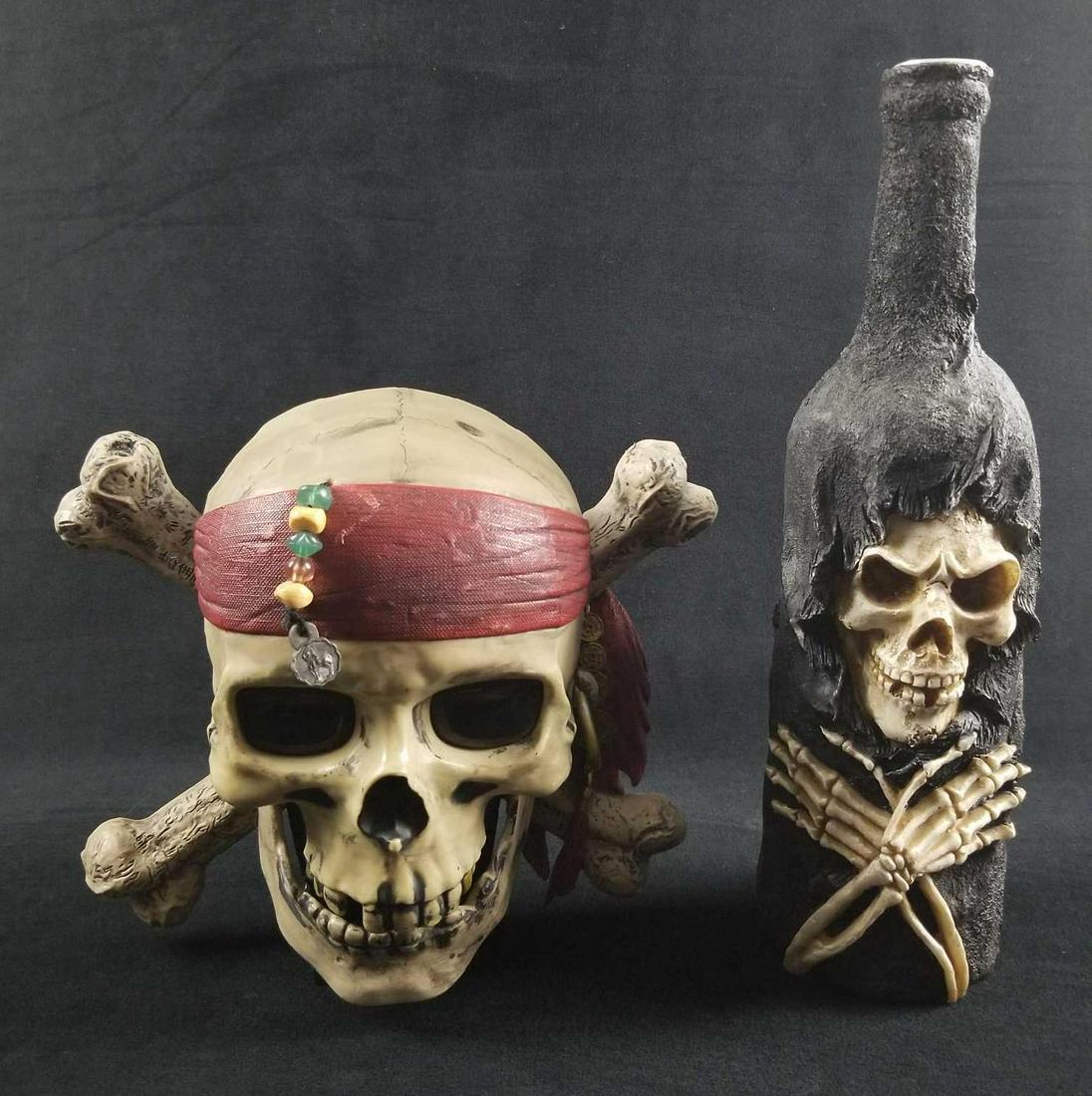Lot of 2 Modern Pirates of the Caribbean Decor: The eyes on the pirate skull light up as seen in the photos.These items are in good condition. There are some known scuffs. in total this lot consists of the following; (1) Pirates of the Caribbean Sk