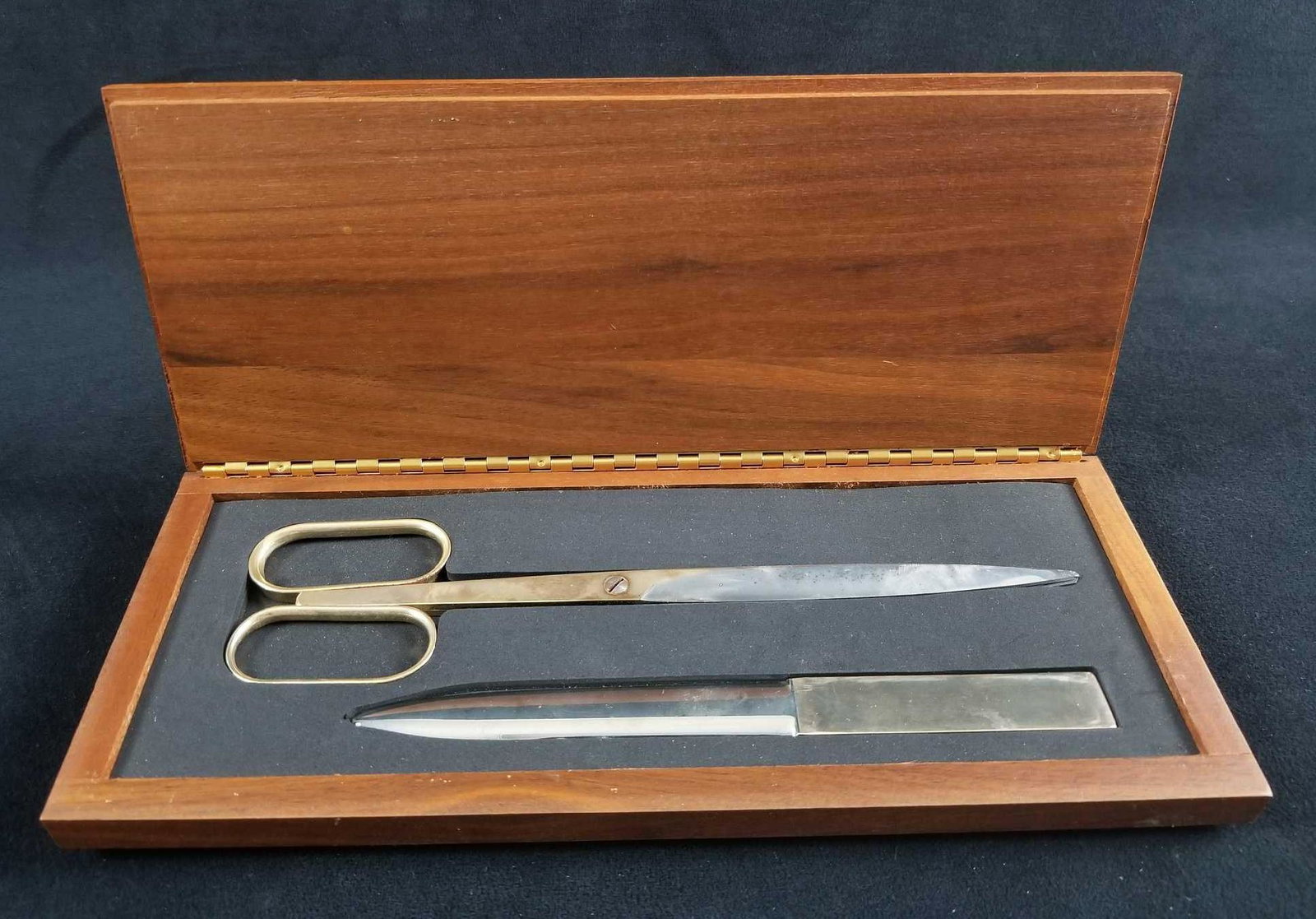 Solingen Germany Scissors and Letter Opener with: This was made in Solingen, Germany. This place is known as the "city of blades". These pieces were popular in many offices of the mid century. This lot consists of the following; (1) Paper scissors. A
