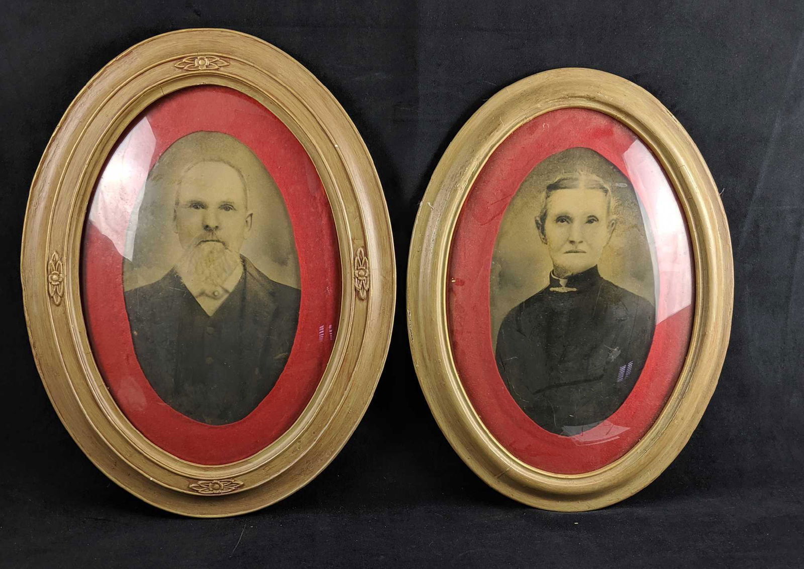 Antique SPOOKY Portrait Set Of Two: This set includes two oval framed hand tinted Carte de visite portraits of a man and woman. Names unknown. Deep scratches on frame with dust behind plexy. Wire on Woman's portrait is damaged and needs