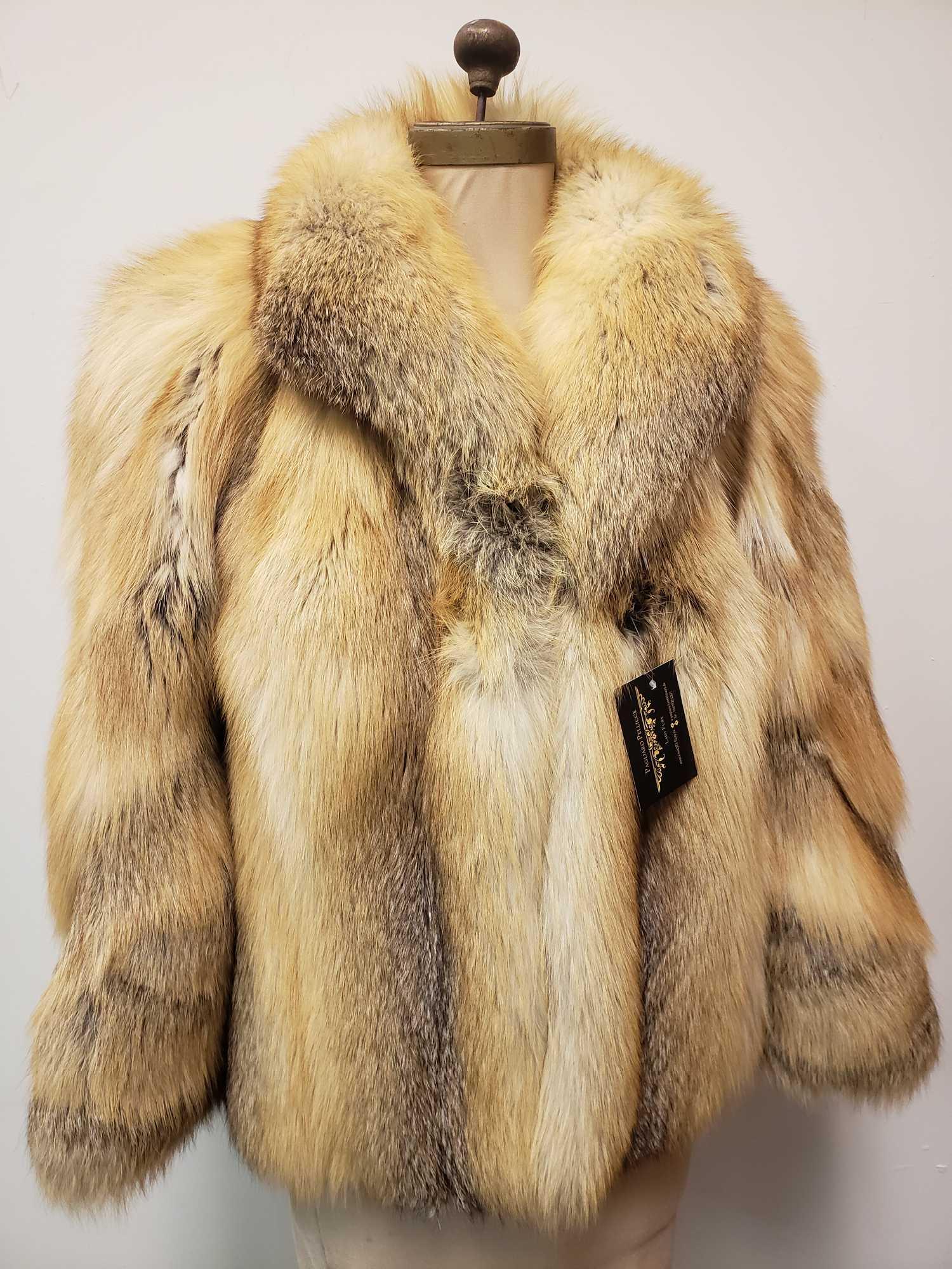 Pagliarro Pellicce Golden Island Fox Fur Coat: Pagliarro Pellicce Golden Island Fox Fur Coat. This fox fur coat is in great used condition. The coat has no known interior or exterior signs of damage. The coat has a hook and loop front closure and