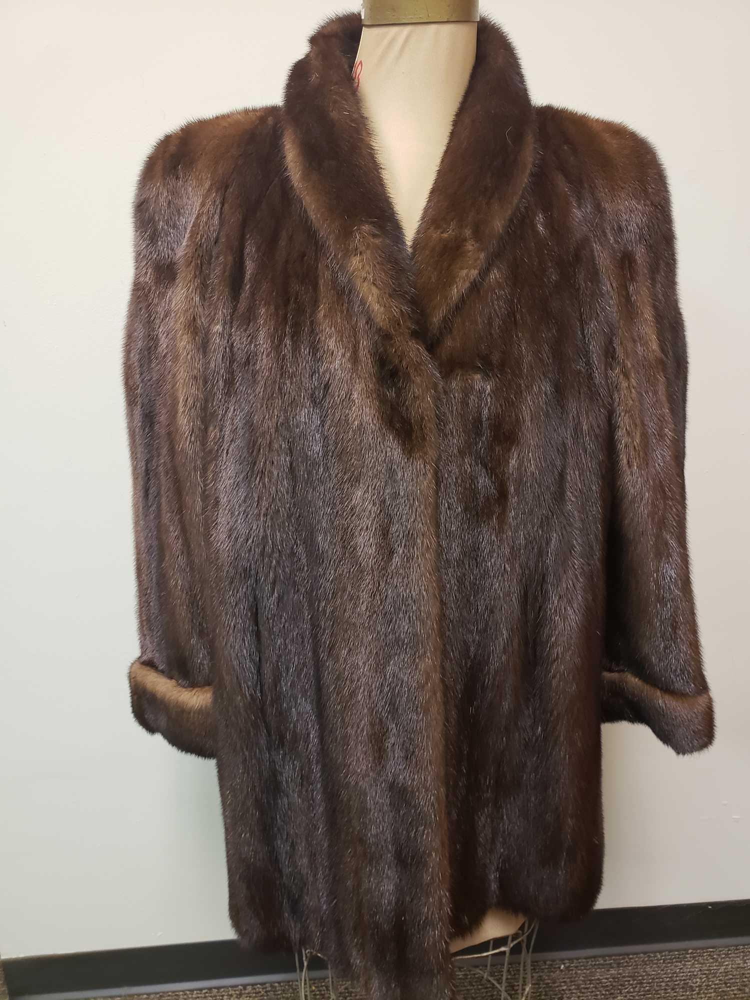 Borello Torino Brown Mink Fur Coat: Borello Torino Brown Mink Fur Coat. This fur coat is in great used condition. The coat has no known interior or exterior signs of damage to it. The coat has a black interior fabric lining and the Bore