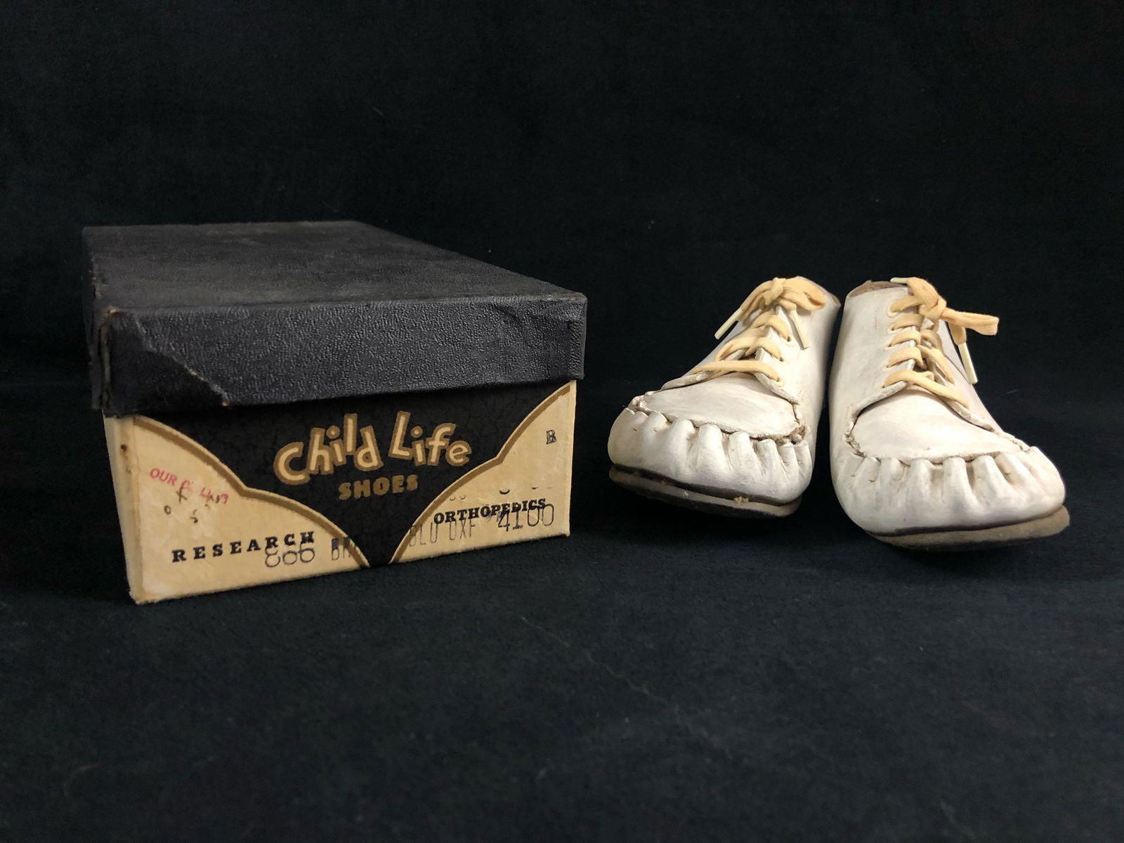 Vintage Baby White Child Shoes: The mid-century leather baby shoes have been painted over with acrylic. The shoes have a cotton shoelace and in good vintage condition. The shoes have no known tears and in good vintage condition. The