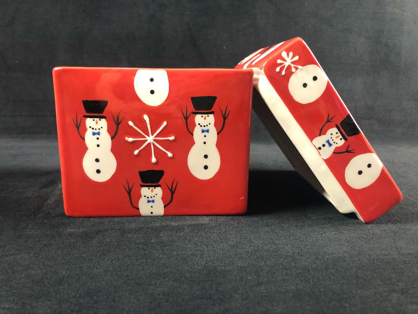 Holiday Christmas Ceramic Box Snowman Snowflakes: Holiday Christmas Ceramic Box Snowman Snowflakes Holiday Trinkets Storage Home Decor This holiday ceramic shaped box is decorated with snowman and snowflakes on a red background. The lid is removable 