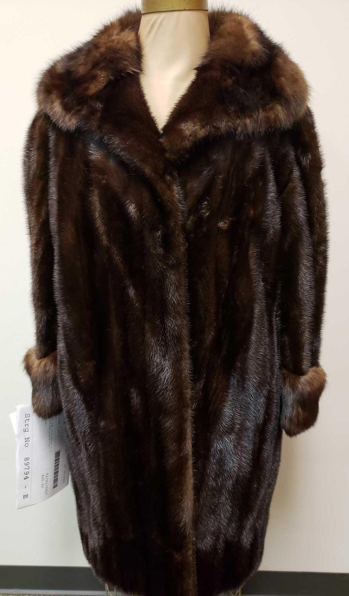 Ken Nanfelt Furs Mahogany Mink with Sable Collar and: Ken Nanfelt Furs Mahogany Mink with Sable Collar and Cuffs. This fur coat is in fair used condition. The coat has a approx. 1.5" tear in the exterior left shoulder (see images). The coat has a brown f