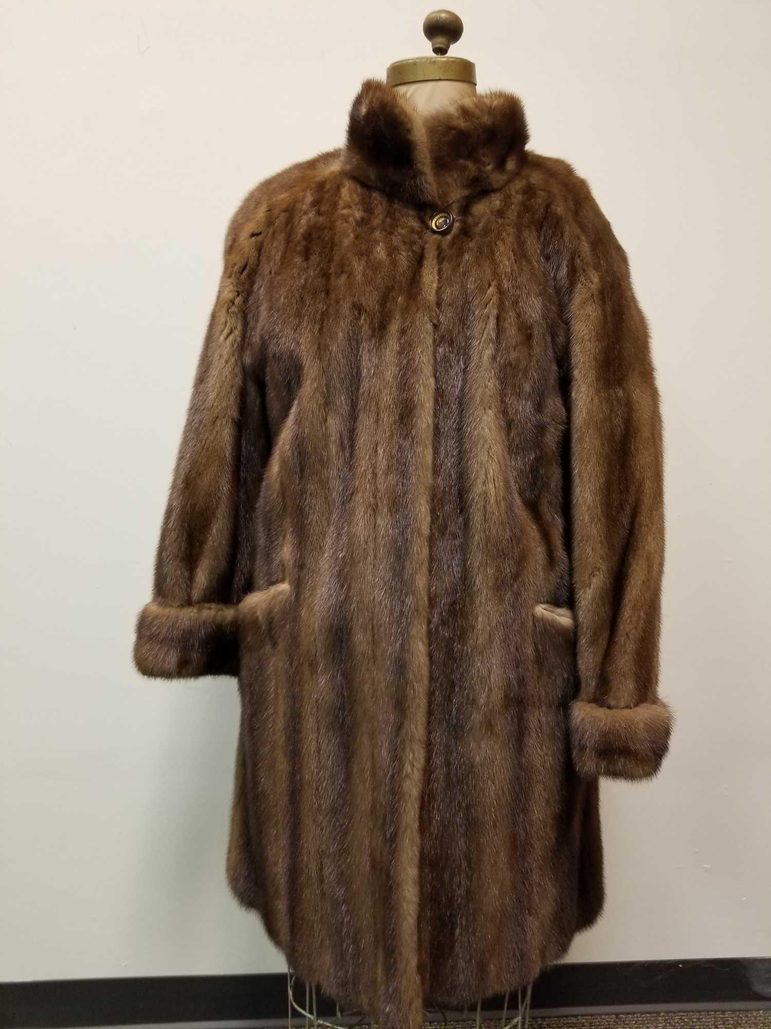Full Length Sable Fur Coat: This darkbrown full length Sable fur coat is by an unknown manufacterer and is in very good condition with no known damages. This coat features brown linen interior, 3 hook and loops and 1 button for