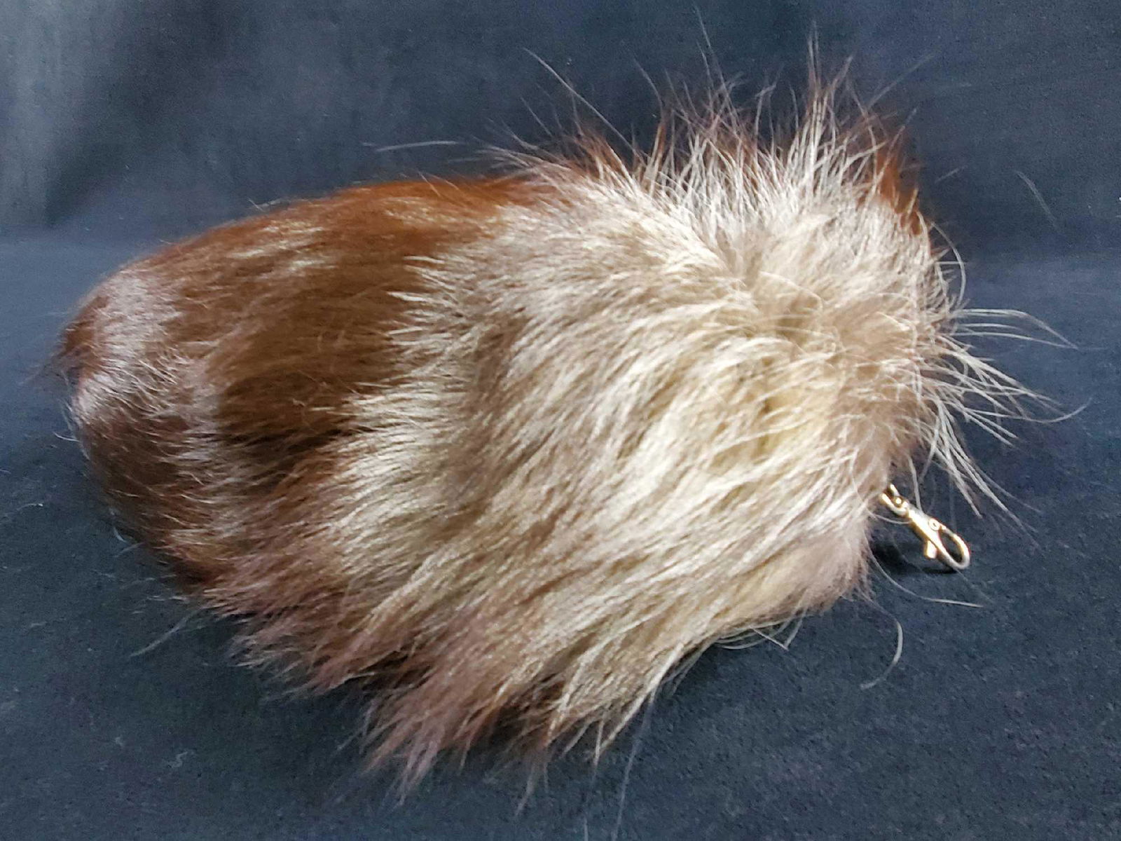Big Silver Fox Tail Fur Bag Tag Accessory Tassel: This is a very plush silver fox tail bag tassel keychain accessory that has dark brown and gray tones. The measurements for the tail are 10" x 5". The tail is attached to a leather piece and has a sil