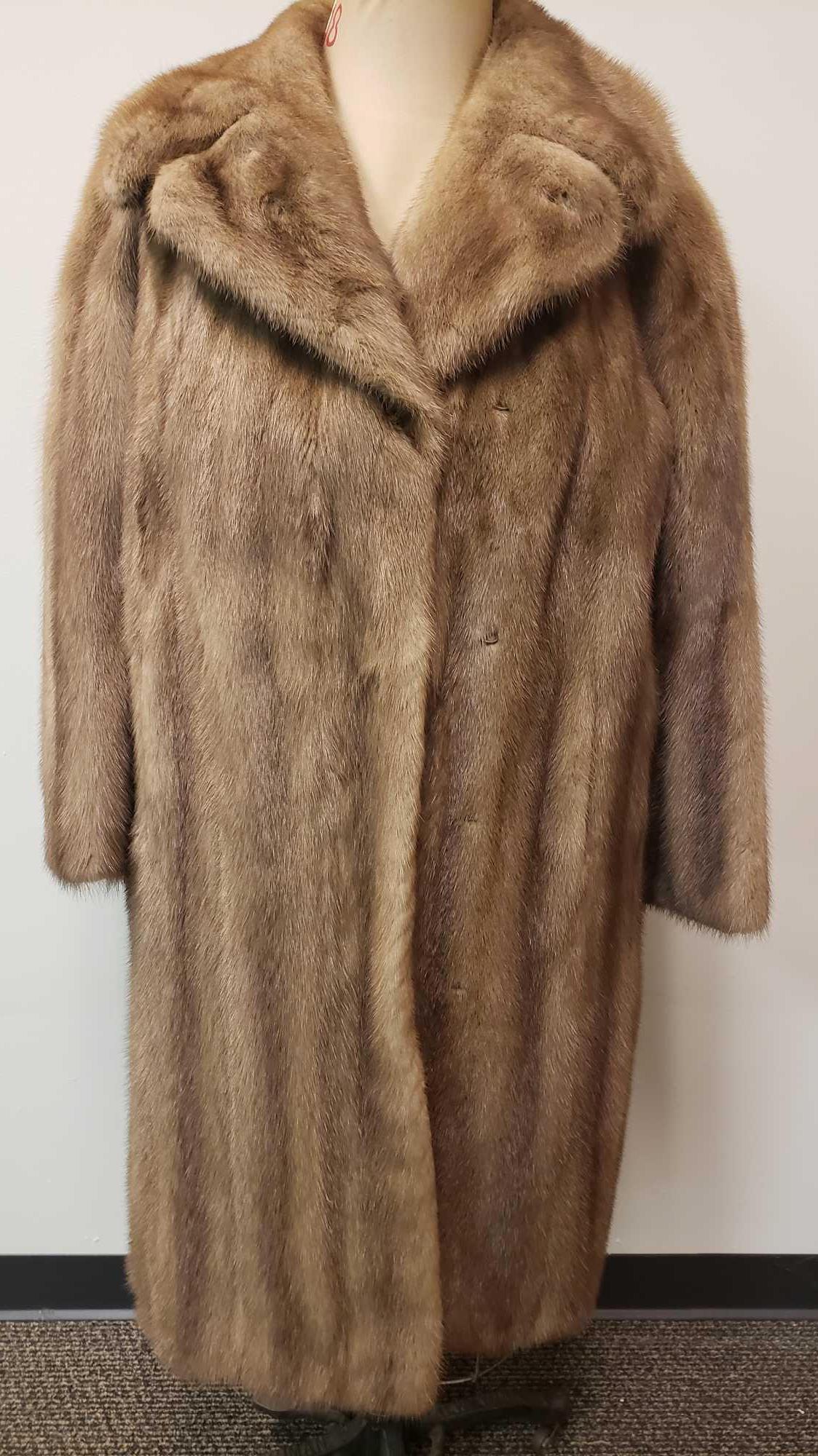 Pastel Mink Fur Coat: Pastel Mink Fur Coat. This fur coat is in great used condition. There is no known damage to the interior or exterior of the coat. The coat has a tan colored interior fabric lining. The lining has a ro