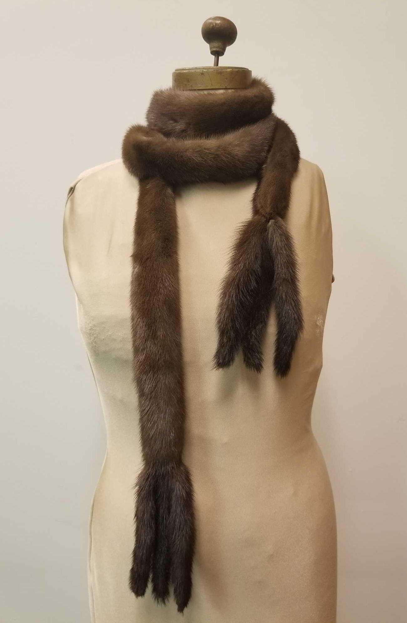 Long Brown Mink Wrap Around Scarf with Tails: This long brown mink wrap around scarf with 6 tails is by an unknown manufacturer and is in very good condition with no known damages. Measures approx 87" long.Â