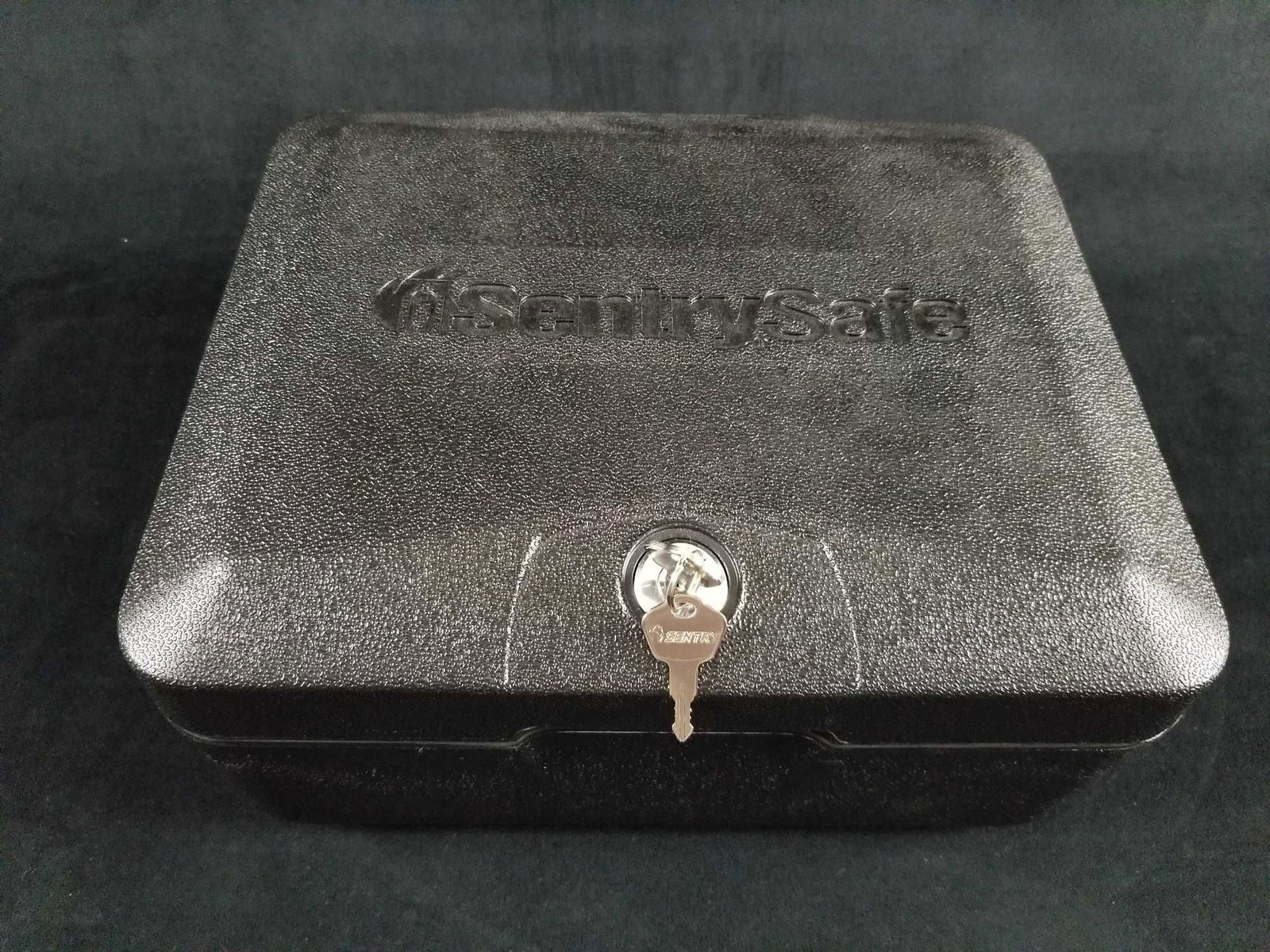 SentrySafe Fireproof Waterproof Box With Key Lock: This Sentrysafe lock box is waterproof and fireproof and is in like new condition with no known damages. The box is made to keep your items/valuables protected for generations to come. The pair of key