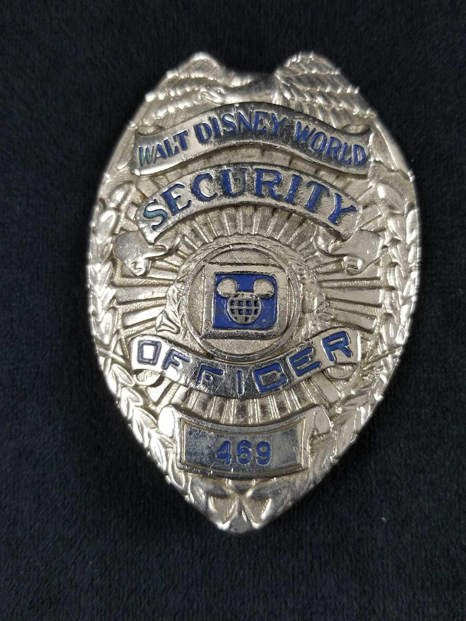 Walt Disney World Security Officer 469 Badge Authentic: Walt Disney World Security Officer 469 Badge Authentic Pin Collector Memorabilia Walt Disney World Security badge with original hardware. This badge adorned on the security guard's uniform. The back o