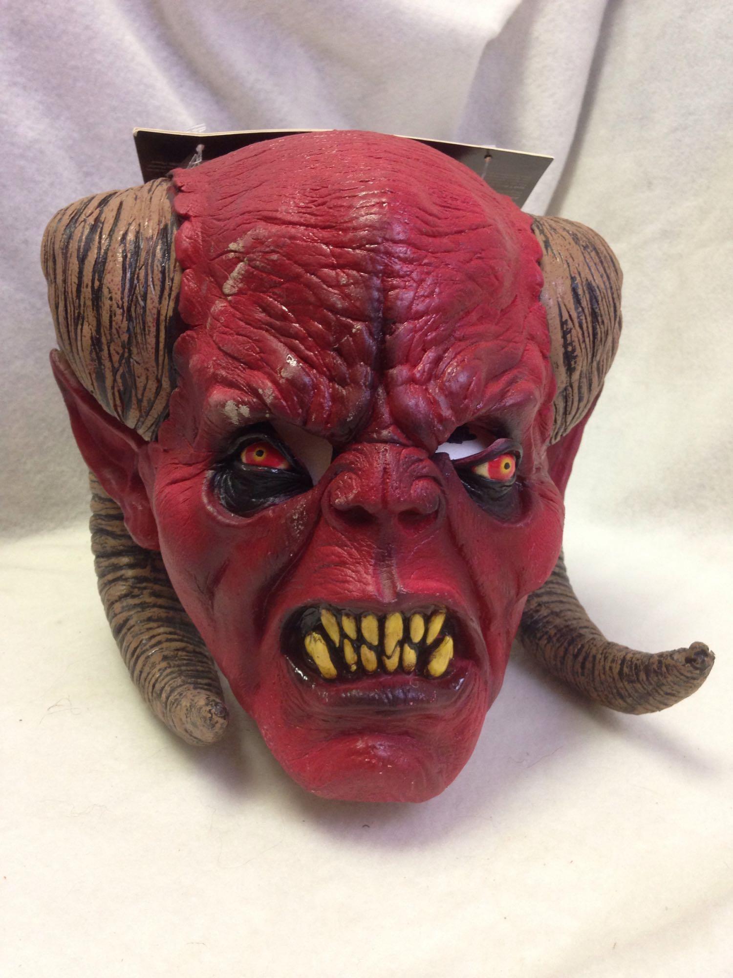 NOS-latex Halloween mask-RED DEMON: Here is a quality made latex Halloween Mask.Â This Little Demon is is grinning from ear to ear.Â You will be too when you are the life of the party this Halloween Season.Â Size: Adult ones si